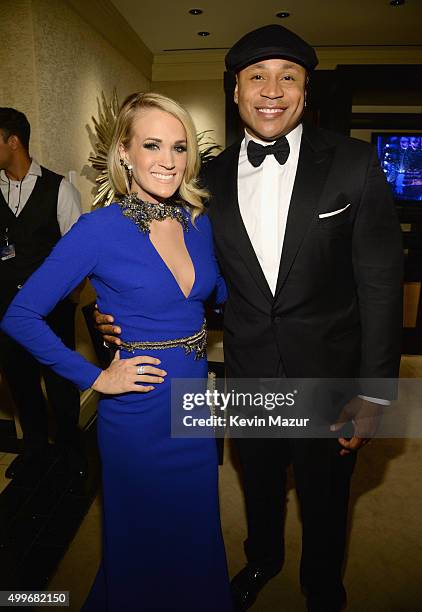 Singer Carrie Underwood and LL Cool J pose backstage during "Sinatra 100: An All-Star GRAMMY Concert" celebrating the late Frank Sinatra's 100th...