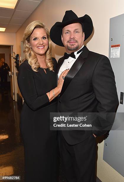 Singers Tricia Yearwood and Garth Brooks pose backstage during "Sinatra 100: An All-Star GRAMMY Concert" celebrating the late Frank Sinatra's 100th...