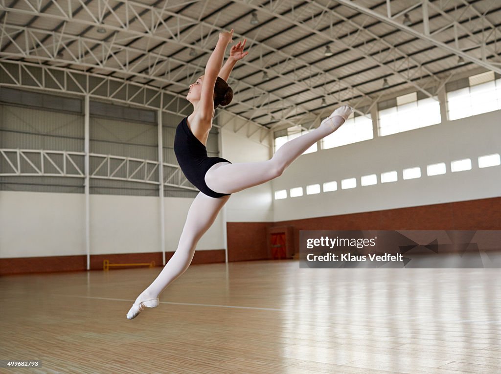Ballet girl practicing jump