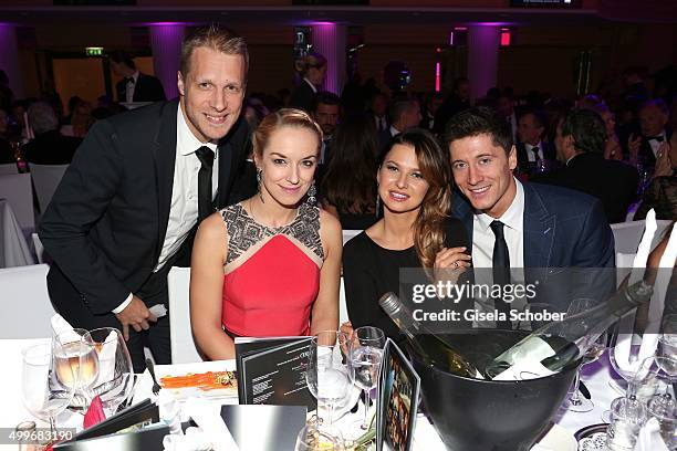 Oliver Pocher, his girlfriend Sabine Lisicki and Robert Lewandowski with his wife Anna attend the Audi Generation Award 2015 at Hotel Bayerischer Hof...