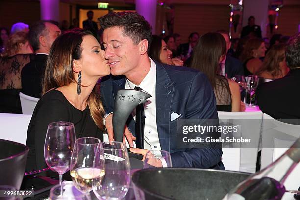 Anna Lewandowski and Robert Lewandowski with award during the Audi Generation Award 2015 at Hotel Bayerischer Hof on December 2, 2015 in Munich,...