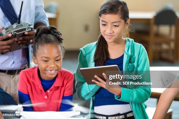 elementary students learning about drone technology in class - kid coding stock pictures, royalty-free photos & images