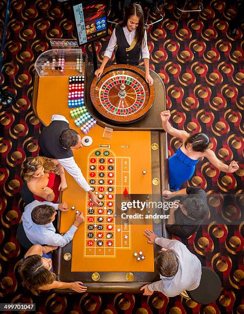 people at the casino - casino dealer stockfoto's en -beelden