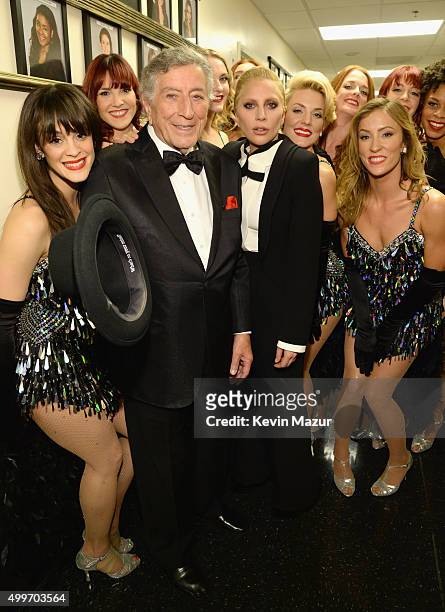 Singers Tony Bennett Lady Gaga pose with dancers backstage during "Sinatra 100: An All-Star GRAMMY Concert" celebrating the late Frank Sinatra's...