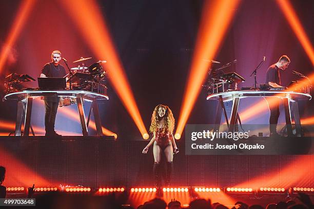 Guy Lawrence and Howard Lawrence of Disclosure perform with Jillian Hervey from Lion Babe at Alexandra Palace on December 2, 2015 in London, England.