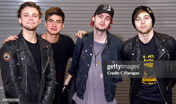 Musicians Ashton Irwin, Calum Hood, Michael Clifford and Luke Hemmings of 5 Seconds of Summer pose backstage during the 6th Annual 99.7 NOW! Triple...