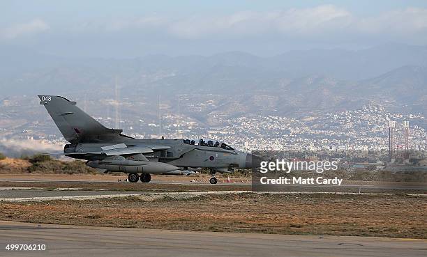 An RAF Tornado returns to RAF Akrotiri after a sortie on December 3, 2015 in Akrotiri, Cyprus. The British Parilament voted 397 to 223 yesterday in...