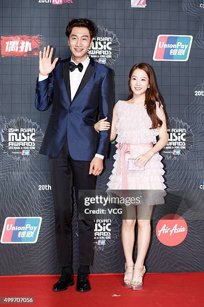 Actor Lee Kwang-soo and actress Park Bo-young arrive at the red carpet of the 2015 Mnet Asian Music Awards at AsiaWorld-Expo on December 2, 2015 in...