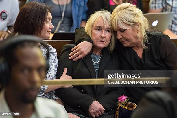 June Steenkamp the mother of Reeve Steenkamp, is conforted as judge Eric Leach reads out the court finding in the Oscar Pistorius trial in...