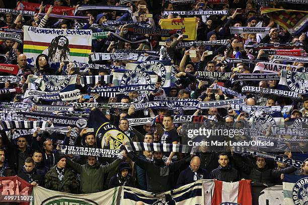 Bordeaux fans hold their scarves aloft during the UEFA Europa League Group B match between Liverpool and FC Girondins de Bordeaux at Anfield on...