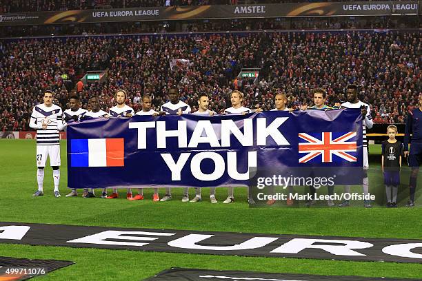 Bordeaux players hold up a banner saying 'Thank You' for the British support following the recent terrorist attacks in Paris before the UEFA Europa...