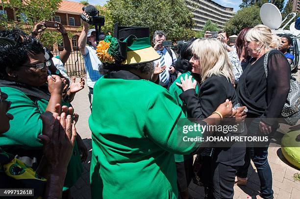 June Steenkamp , the mother of Reeve Steenkamp, is embraced by African National Congress Women League members after the court finding in the Oscar...