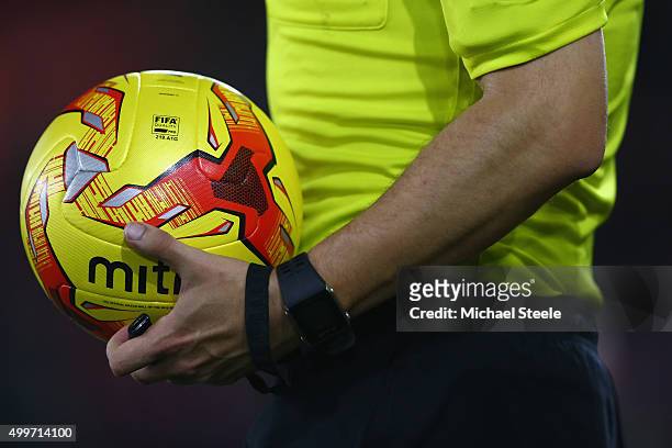 Referee Rob Madley carries the match ball ahead of the Capital One Cup Quarter Final match between Southampton and Liverpool at St Mary's Stadium on...