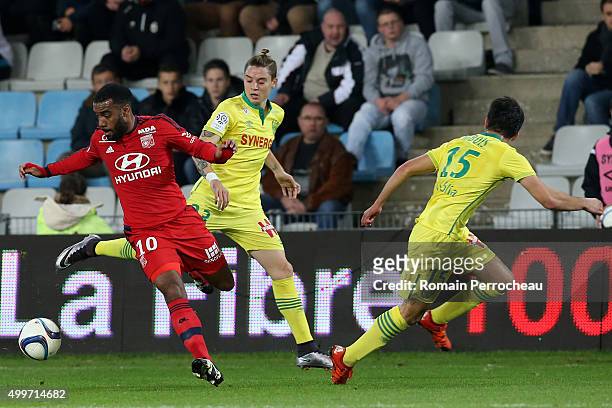 Alexandre Lacazette of Olympique Lyonnais and Adryan of Nantes FC battle for the ball during the French Ligue 1 game between Nantes FC and Olympique...