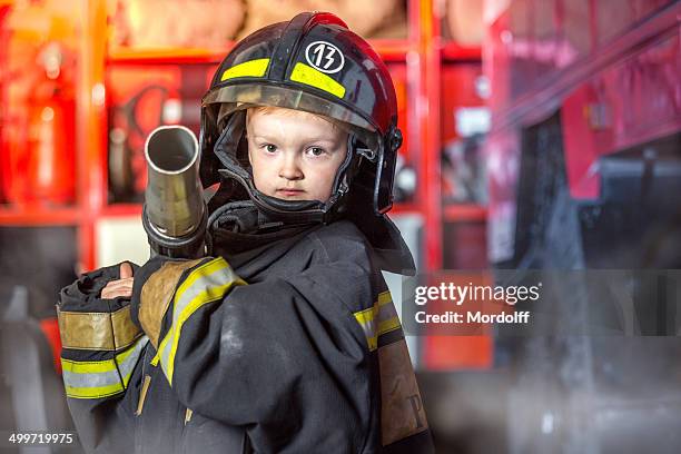 all to extinguish fire - firefighter stock pictures, royalty-free photos & images