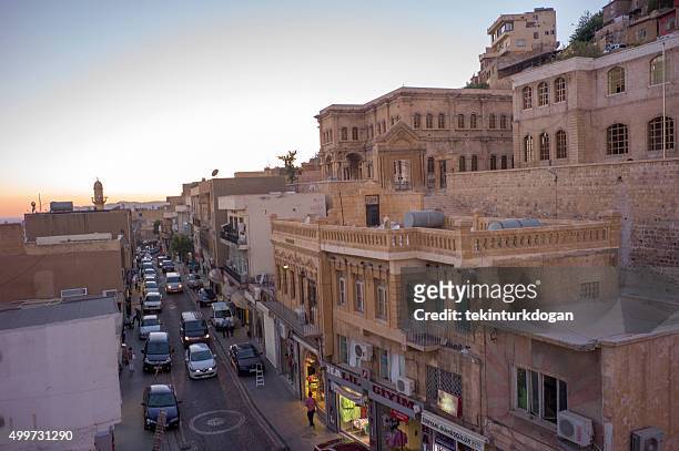 traditional houses at narrow street of middleeastern town mardin turkey - mardin stock pictures, royalty-free photos & images
