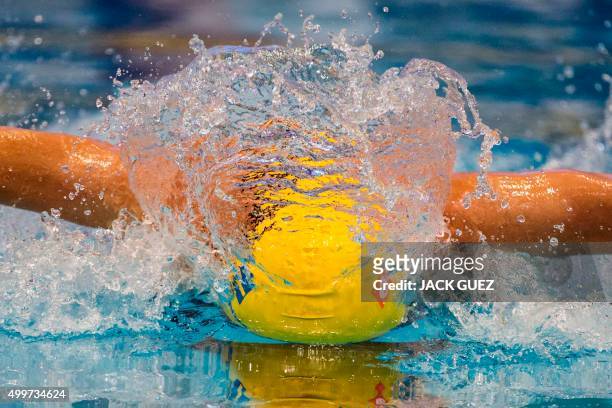 Sweden's Sarah Sjoestroem competes in the preliminary women's 50m butterfly event at the 18th European Short Course Swimming Championships in the...