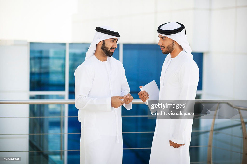 Critical Enterpreneur With Colleague In A Meeting Outside Offices