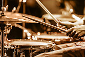 Drummer playing drums on stage