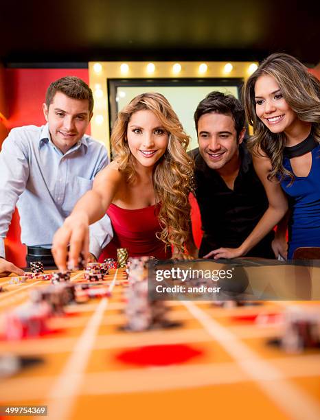 people playing the roulette - roulotte stock pictures, royalty-free photos & images