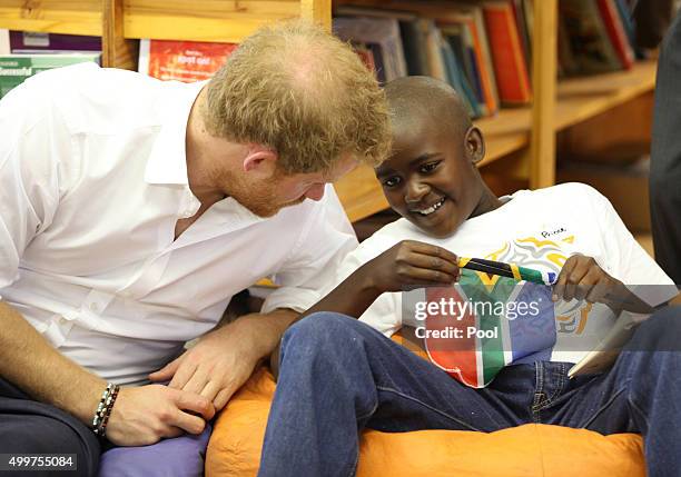 Prince Harry meets Prince mtimkulul as he visits Siyabonga Secondary School and meets children participating in the Nelson Mandela Champion within...