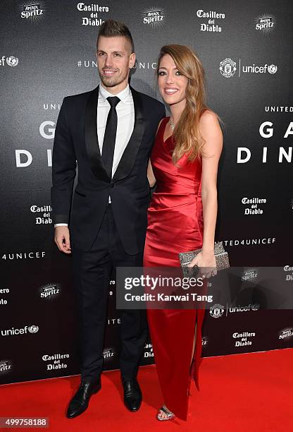 Morgan Schneiderlin and Camile Sold attend the United for UNICEF Gala Dinner at Old Trafford on November 29, 2015 in Manchester, England.