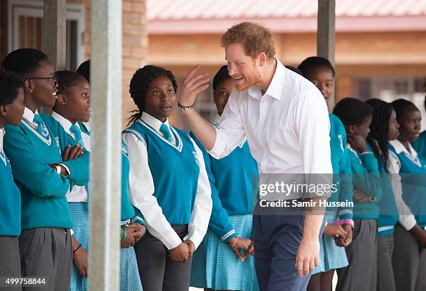 Prince Harry visits Siyabonga Secondary School and meets children participating in the Nelson Mandela Champion within program in Soweto during an...