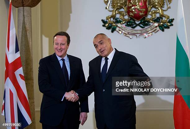 Bulgarian Prime minister Boyko Borisov shakes hands with British counterpart David Cameron prior their meeting in Sofia on December 3, 2015. / AFP /...
