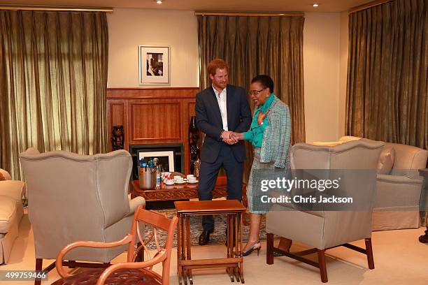 Prince Harry in Nelson Mandela's office with Graca Machel his widow at the Nelson Mandela Foundation Centre of Memory on December 3, 2015 in...