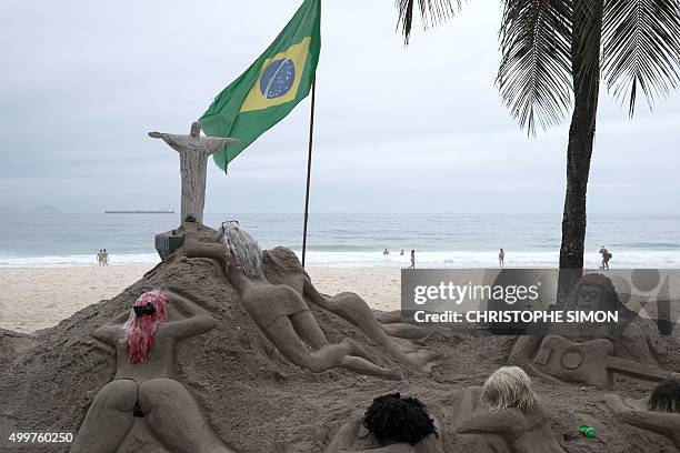 View of sand sculptures of women -which have been done by Ubiratan da Conceiçao dos Santos for 23 years- at Copacabana beach in Rio de Janeiro,...