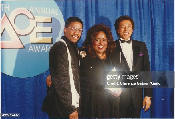 Jennifer Holliday, Smokey Robinson, and Herbie Hancock holding an award for Outstanding Performance in a Musical Special during the 1988 ACE awards...