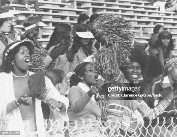 African-American cheerleaders performing a routine, San Francisco, California, 1980.