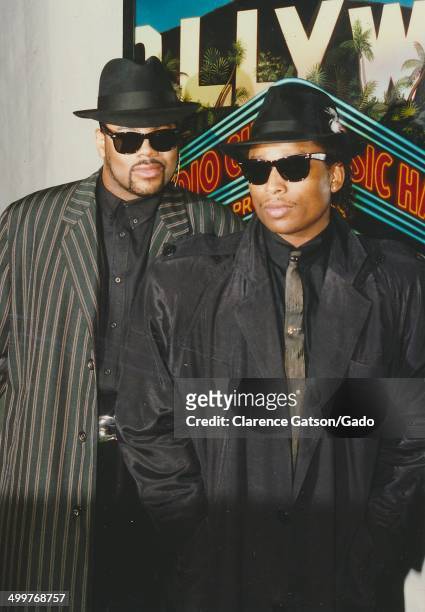 Music producers Jimmy Jam and Terry Lewis, wearing tophat and sunglasses, posing during the 1988 ACE awards for cable television, Los Angeles,...