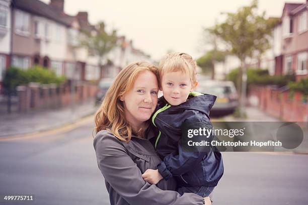 mother and son - england street stock pictures, royalty-free photos & images