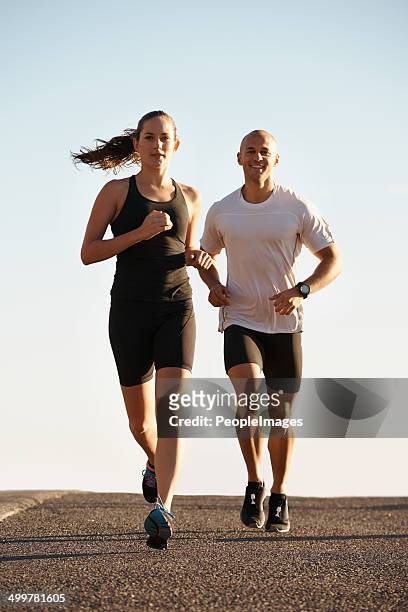 running is it's own reward - two women running stock pictures, royalty-free photos & images