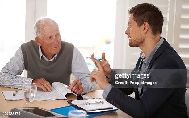 explaining his options regarding the deal - old accountant stock pictures, royalty-free photos & images