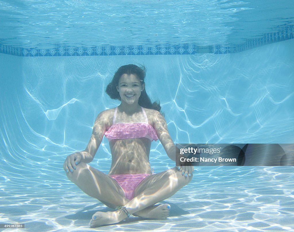 Caucasian Teenage Girl Underwater Dong Yoga.