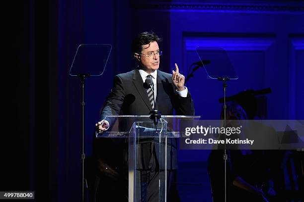 Comedian Stephen Colbert speaks on stage during the ONE Campaign and 's concert to mark World AIDS Day, celebrate the incredible progress that's been...