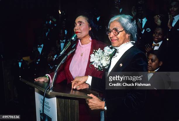 American Civil Rights activists Coretta Scott King and Rosa Parks stand together at a lectern during the opening of an exhibit of memorabilia from...
