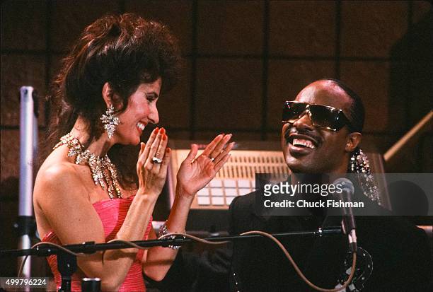 American actress Susan Lucchi and Jazz & Pop musician Stevie Wonder on the set of the television soap opera 'All My Children,' New York, New York,...