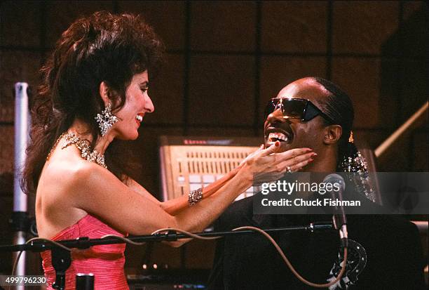 American actress Susan Lucchi and Jazz & Pop musician Stevie Wonder on the set of the television soap opera 'All My Children,' New York, New York,...