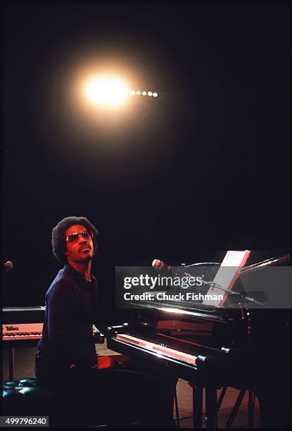 During a reheareal, American Jazz and Pop musician Stevie Wonder sits between an electric piano and a baby grand onstage at Radio City Music Hall,...