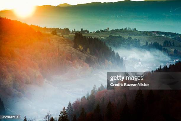 sunrise over a romanian village - siebenbürgen stockfoto's en -beelden