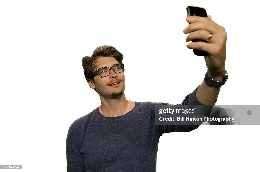 Young man mobile camera selfie