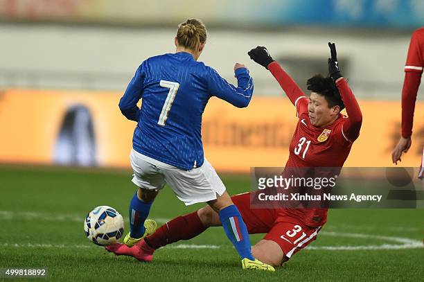 Dec. 3, 2015 -- Italy's Cernoia Valentina, left, vies with China's Ma Xiaoxu during their international friendly women's soccer match in Guiyang,...