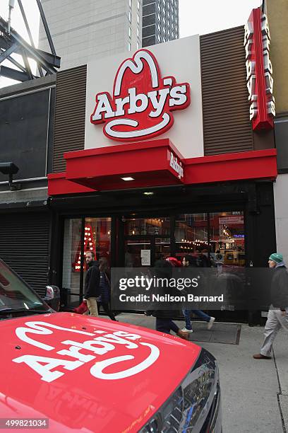 Guests arrive as Arby's gives fans a sneak peek at its new Manhattan restaurant at 40th St. And 8th Ave on December 3, 2015 in New York City.