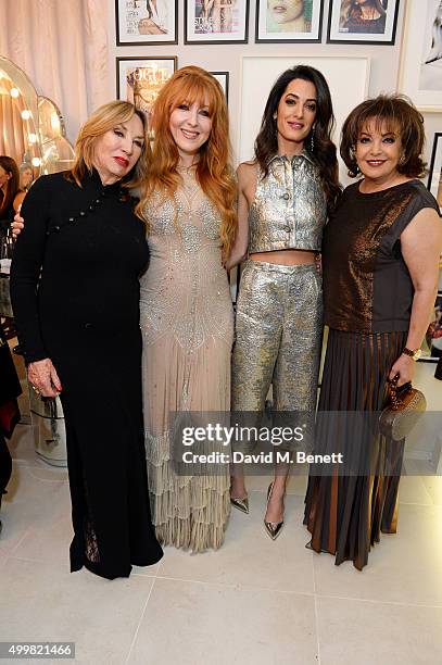 Patsy Tilbury, Charlotte Tilbury, Amal Clooney and mother Baria Alamuddin attend Charlotte Tilbury's naughty Christmas party celebrating the launch...