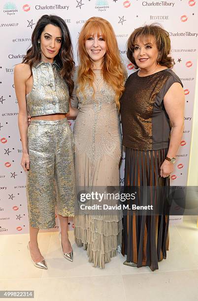 Amal Clooney, Charlotte Tilbury and Amal's mother Baria Alamuddin attend Charlotte Tilbury's naughty Christmas party celebrating the launch of...