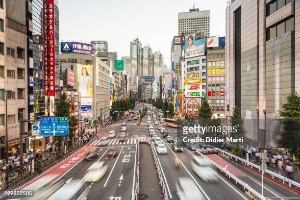 Cars rushing in Shinjuku, one of the main important business district of Tokyo, the capital city of Japan.
