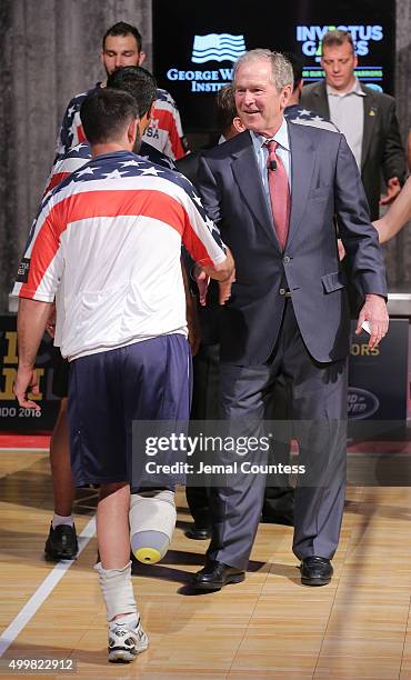 Staff Sergeant Nicholas Dadgostar greets Former President George W. Bush during an event to announce a major initiative prior to the 2016 Invictus...